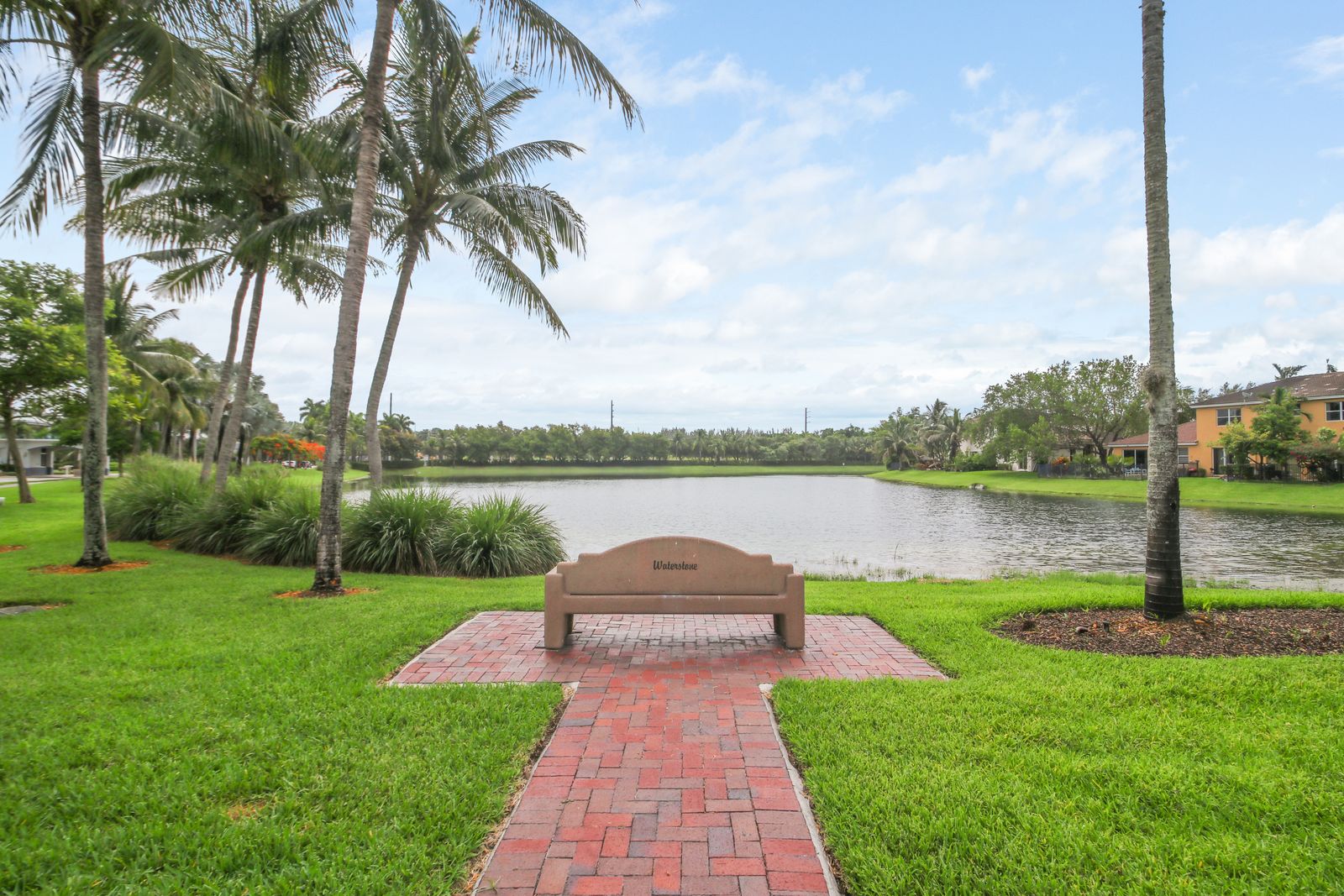 Lakeside bench on the Stonebrook walking trail