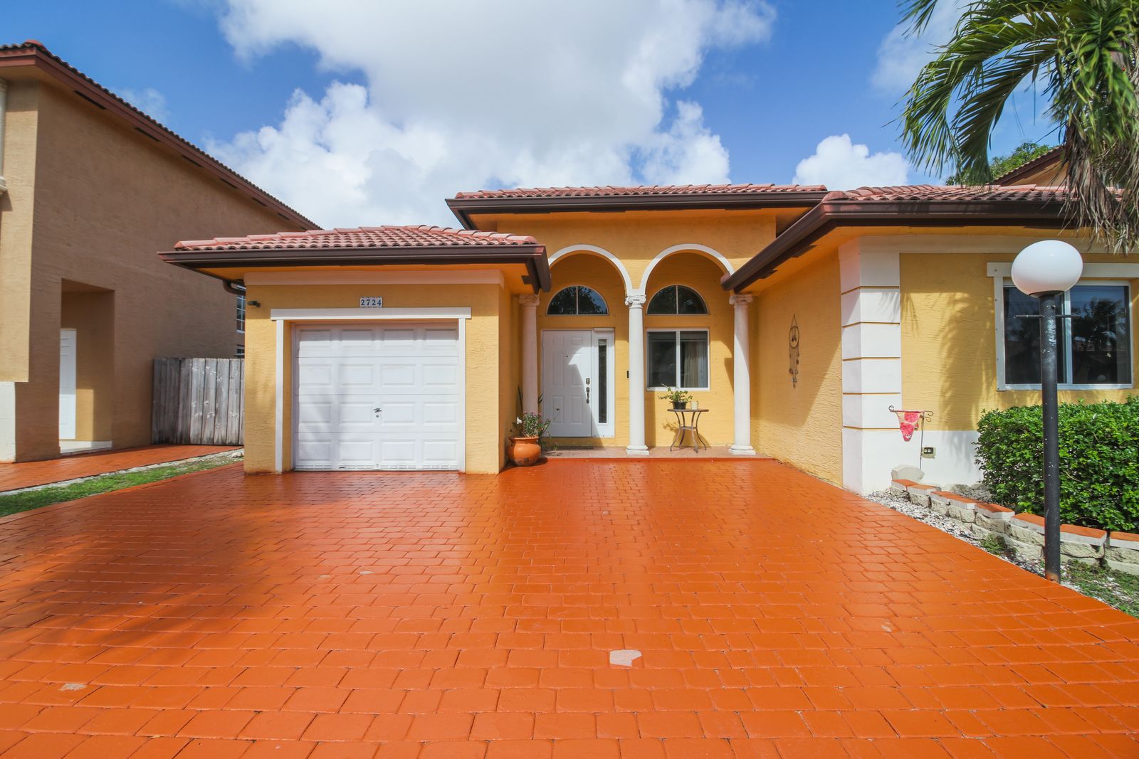 Paver driveway and 1-car garage